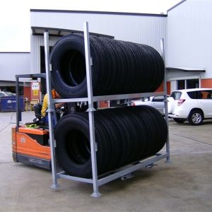Tyre Racks stacked on top of each other being transported via forklift